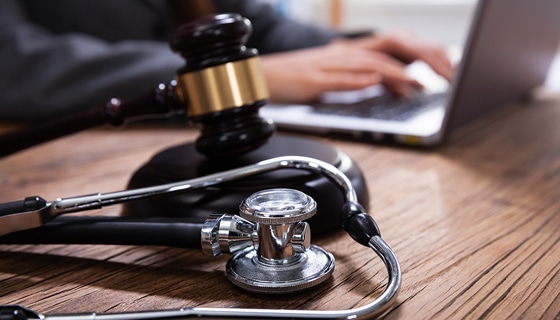 Mallet And Stethoscope On Gavel Over The Office Desk